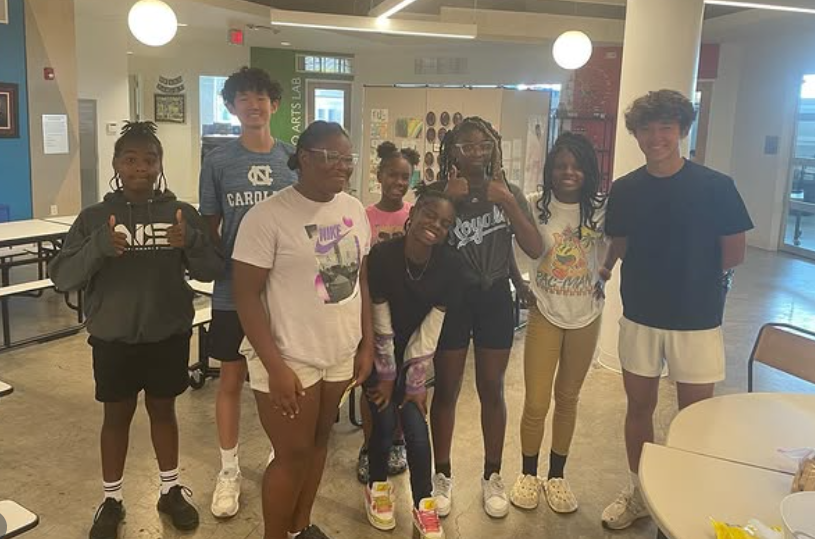 Students and volunteers at a youth financial literacy program